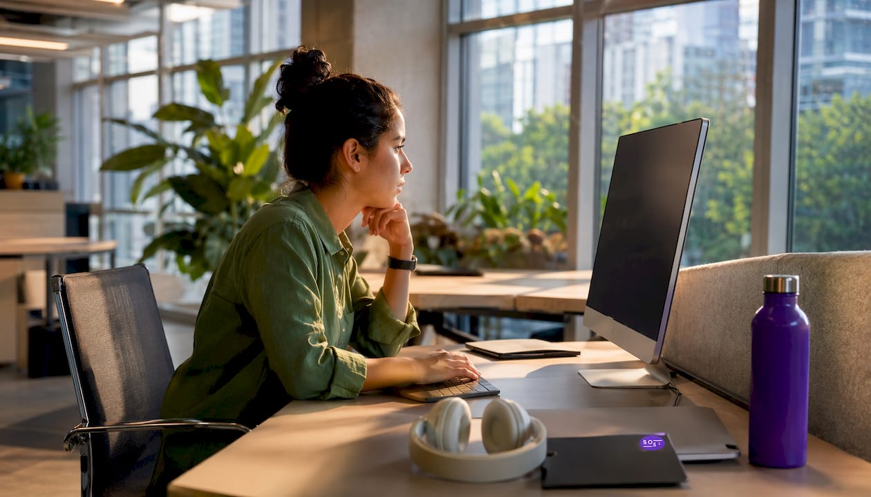 Woman analyzing landing page conversion data in office