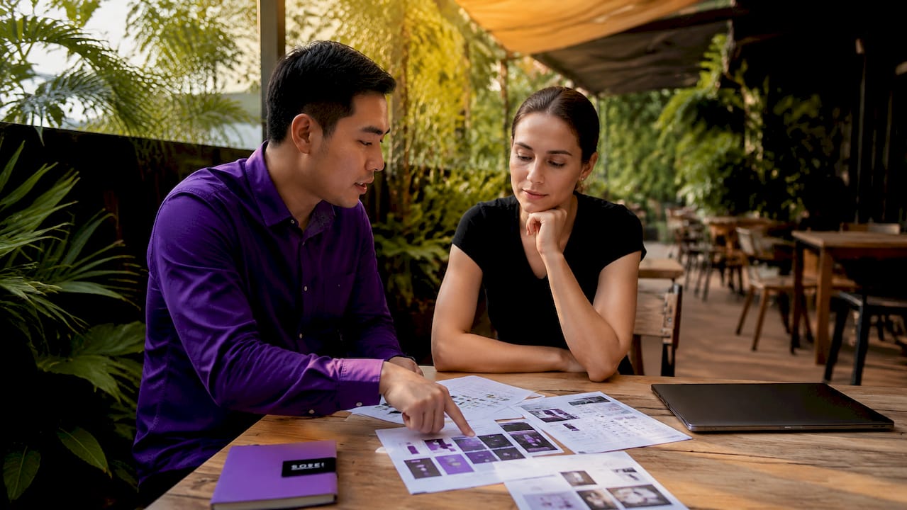 Two small business owners reviewing ecommerce options